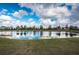 Scenic view of community pond with reflective water and lush landscaping at 5316 Stoic Vale Dr, Wimauma, FL 33598