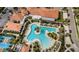 Stunning aerial view of a resort-style pool with lush landscaping and comfortable lounge areas at 5316 Stoic Vale Dr, Wimauma, FL 33598