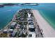Stunning aerial view of a beachfront community showcasing the building's location and proximity to the ocean at 555 Gulf Way # 7N, St Pete Beach, FL 33706