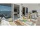 Spacious balcony with ocean views features stylish seating, connecting indoor-outdoor living seamlessly at 555 Gulf Way # 7N, St Pete Beach, FL 33706