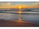 Gorgeous beach sunset with shimmering water, reflecting the warm, golden hues of the setting sun at 555 Gulf Way # 7N, St Pete Beach, FL 33706