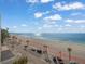 Expansive beach view showcasing the ocean, sand, and sky from a high-rise vantage point at 555 Gulf Way # 7N, St Pete Beach, FL 33706