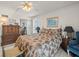 Bedroom with bright natural light, ceiling fan, and comfortable furnishings at 555 Gulf Way # 7N, St Pete Beach, FL 33706