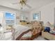 Bedroom with a ceiling fan and view of the intercoastal waters at 555 Gulf Way # 7N, St Pete Beach, FL 33706