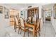 Dining room featuring a wooden table, six chairs, and access to the kitchen at 555 Gulf Way # 7N, St Pete Beach, FL 33706