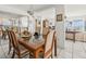 Elegant dining room with a glass-top table and seating for six, perfect for entertaining at 555 Gulf Way # 7N, St Pete Beach, FL 33706