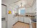 Kitchen with ample cabinet space and appliances; bright with natural light at 555 Gulf Way # 7N, St Pete Beach, FL 33706