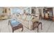 Bright living room features a large window, tile floors, and elegant furnishings at 555 Gulf Way # 7N, St Pete Beach, FL 33706
