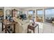 Comfortable living area with plush seating, tile flooring, and sliding glass doors to the balcony at 555 Gulf Way # 7N, St Pete Beach, FL 33706