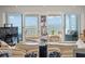 Cozy living space boasts sliding glass doors leading to a balcony with ocean views at 555 Gulf Way # 7N, St Pete Beach, FL 33706