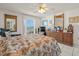 Sunny bedroom featuring a large window and traditional furnishings at 555 Gulf Way # 7N, St Pete Beach, FL 33706