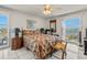 Bright bedroom with tiled floors, ceiling fan, and a relaxing water view at 555 Gulf Way # 7N, St Pete Beach, FL 33706