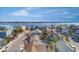 Charming coastal neighborhood with colorful houses, lush palm trees, and inviting community atmosphere near the bay at 555 Gulf Way # 7N, St Pete Beach, FL 33706