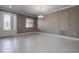 Bright and airy living room with tile floors, crown molding, and a large window at 624 Tierra Dr, Spring Hill, FL 34609