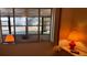 Cozy bedroom featuring bright natural light from a large window and lamps at 7040 Cognac Dr # 1, New Port Richey, FL 34653