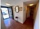 Inviting entryway with wood floors, decorative mirror, and access to various rooms at 7040 Cognac Dr # 1, New Port Richey, FL 34653