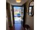 Welcoming entryway with wooden floors, an open door, and a view of the neighborhood at 7040 Cognac Dr # 1, New Port Richey, FL 34653