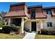 Charming townhouse featuring well-kept landscaping and a welcoming entryway at 7040 Cognac Dr # 1, New Port Richey, FL 34653