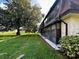View of the building's exterior, showcasing the architecture and landscape at 7040 Cognac Dr # 1, New Port Richey, FL 34653