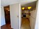 A glimpse of the kitchen from the foyer, showcasing the kitchen's retro style at 7040 Cognac Dr # 1, New Port Richey, FL 34653