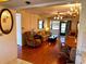 Comfortable living room featuring hardwood floors, a ceiling fan, and an open layout at 7040 Cognac Dr # 1, New Port Richey, FL 34653