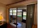 Bright sunroom with tile flooring, sliding glass doors, and tranquil views at 7040 Cognac Dr # 1, New Port Richey, FL 34653