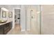 Luxurious bathroom with a glass shower enclosure and a spacious vanity area at 8092 Moonbeam Ave, Sarasota, FL 34241