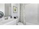 Well-lit bathroom featuring stylish white subway tile in the shower and modern fixtures at 8092 Moonbeam Ave, Sarasota, FL 34241