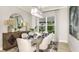 Dining area with an elegant table setting, modern lighting, and decor at 8100 Moonbeam Ave, Sarasota, FL 34241