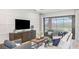 Cozy living room features stylish decor, plush seating, and sliding glass doors to the outdoor area at 8100 Moonbeam Ave, Sarasota, FL 34241