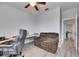 The bedroom area features a gray sofa and work space at 10019 Celtic Ash Dr, Ruskin, FL 33573