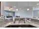 The spacious kitchen showcases a granite countertop, stainless steel sink, and modern pendant lighting at 10019 Celtic Ash Dr, Ruskin, FL 33573