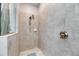 Tiled walk-in shower features tiled walls, shower head and built-in soap dish at 10019 Celtic Ash Dr, Ruskin, FL 33573