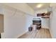 Walk-in closet with storage shelving and modern gray plank flooring at 10019 Celtic Ash Dr, Ruskin, FL 33573