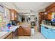 Kitchen with dark brown wood cabinets and tile floors at 10171 Patrick St, Brooksville, FL 34601