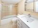 Bright bathroom with tub, shower, and vanity with white countertop at 10346 Carrollwood Ln # 171, Tampa, FL 33618