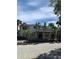 Exterior shot of building entrance with prominent signage and palm tree landscaping at 10346 Carrollwood Ln # 171, Tampa, FL 33618