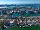 Aerial view of waterfront property with a private dock, swimming pool, and city skyline views at 124 Leeward Is, Clearwater Beach, FL 33767