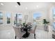 Dining area with waterfront views, a round table, and plenty of natural light at 124 Leeward Is, Clearwater Beach, FL 33767