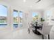 Dining room with water views, a dining table, and abundant natural light at 124 Leeward Is, Clearwater Beach, FL 33767