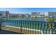 Waterfront view from balcony showing buildings across canal and boats docked on a sunny day at 124 Leeward Is, Clearwater Beach, FL 33767