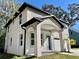 Angle view of charming two-story home featuring stucco siding and covered entryway at 16417 Lake Byrd Dr, Tampa, FL 33618