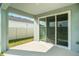 Covered patio area with sliding glass doors, overlooking the backyard at 16631 Mooner Plank Cir Cir, Wimauma, FL 33598