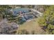 Aerial photo features pool, deck, and oversized lot with privacy fence at 17480 Nuthatch Rd, Weeki Wachee, FL 34614