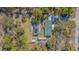 Aerial view of the property featuring a private backyard oasis with a screened pool at 17480 Nuthatch Rd, Weeki Wachee, FL 34614