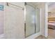 Bathroom with a sliding glass door shower and a view into the main bedroom at 17480 Nuthatch Rd, Weeki Wachee, FL 34614