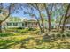 Charming single story home with screened porch, green shutters and well maintained landscaping at 17480 Nuthatch Rd, Weeki Wachee, FL 34614