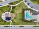 Aerial view of community pool and playground area within planned neighborhood at 17628 Breakaway St, Land O Lakes, FL 34638