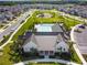 Aerial view of the community clubhouse with a pool, playground, and green space at 17628 Breakaway St, Land O Lakes, FL 34638