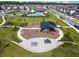 An aerial view of the community, showcasing the playground, pool and green space at 17628 Breakaway St, Land O Lakes, FL 34638